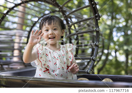 Pretty girls playing in the park Pretty girls playing in the park 117967716