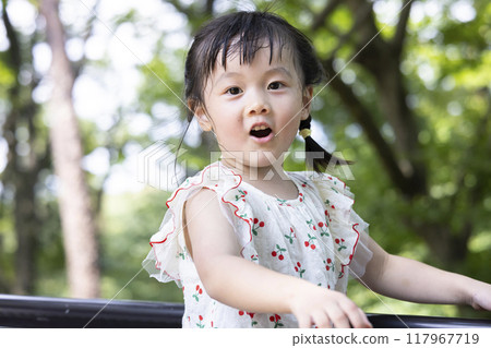 Pretty girls playing in the park 117967719