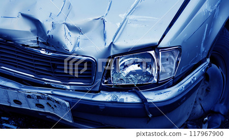 The front of a car damaged in a traffic accident 117967900