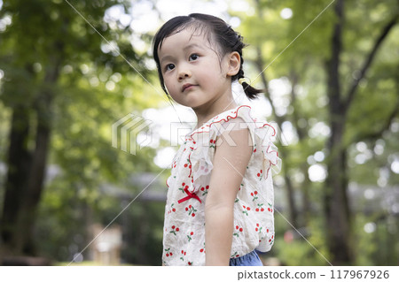 Pretty girls playing in the park Pretty girls playing in the park 117967926