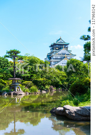 Osaka Castle, view of the castle tower from the Japanese garden southwest of Honmaru Square Osaka Castle, view of the castle tower from the Japanese garden southwest of Honmaru Square 117968142