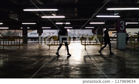 people walk through the closed parking. 117969634