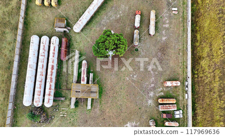 old rusty fuel barrels drone view 117969636