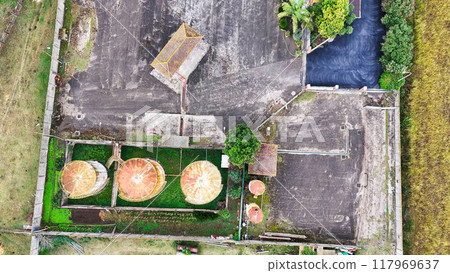 old rusty fuel barrels drone view 117969637