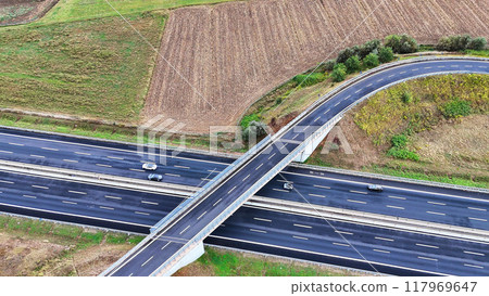 Arial view of Modern transportation with Expressway Road highway Top view. Important infrastructure. Arial view of Modern transportation with Expressway Road highway Top view. Important infrastructure. 117969647