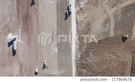 heavy construction equipment on a construction site heavy construction equipment on a construction site 117969678