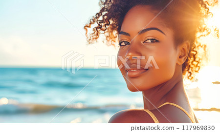 Happy dark skinned woman posing on the beach 117969830