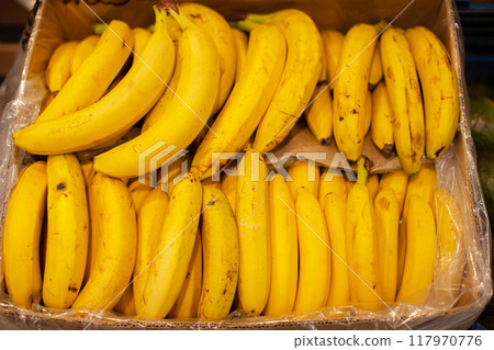 The banana branches in the box are shot from above. The banana branches in the box are shot from above. 117970776