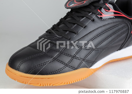 Part of a black leather sneaker with stitching close-up. Part of a black leather sneaker with stitching close-up. 117970887