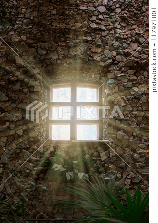 Rays of sunlight from the windows of an ancient stone building. 117971001