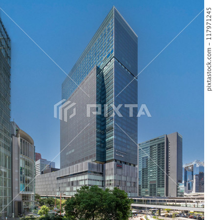 The exterior of JP Tower Osaka (KITTE Osaka) on a clear day, located on the former site of the Osaka Central Post Office, directly connected to JR Osaka Station. Next to Umeda Station The exterior of JP Tower Osaka (KITTE Osaka) on a clear day, located on the former site of the Osaka Central Post Office, directly connected to JR Osaka Station. Next to Umeda Station 117971245