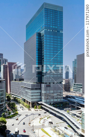 The exterior of JP Tower Osaka (KITTE Osaka) on a clear day, located on the former site of the Osaka Central Post Office, directly connected to JR Osaka Station. Next to Umeda Station 117971260