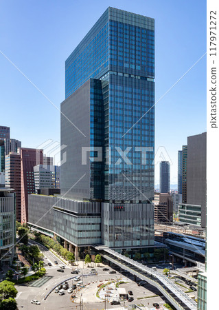 The exterior of JP Tower Osaka (KITTE Osaka) on a clear day, located on the former site of the Osaka Central Post Office, directly connected to JR Osaka Station. Next to Umeda Station The exterior of JP Tower Osaka (KITTE Osaka) on a clear day, located on the former site of the Osaka Central Post Office, directly connected to JR Osaka Station. Next to Umeda Station 117971272