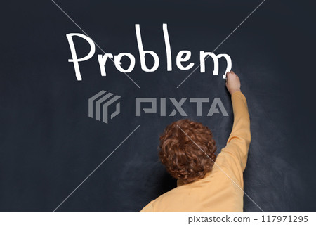Redhead preteen child writing Problem inscription on blackboard Redhead preteen child writing Problem inscription on blackboard 117971295
