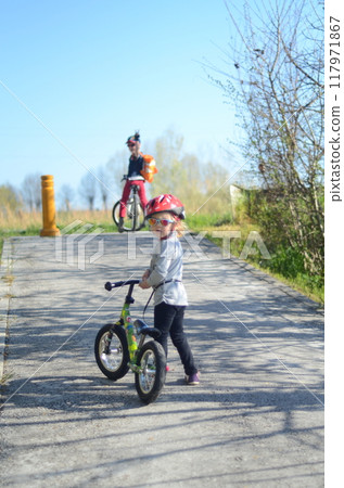 Brother and sister riding bicycles Brother and sister riding bicycles 117971867