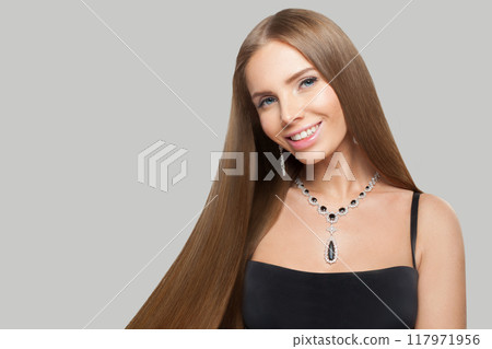 Charming jewelry woman with long healthy hair wearing glamour jewellery necklace. Charming jewelry woman with long healthy hair wearing glamour jewellery necklace. 117971956