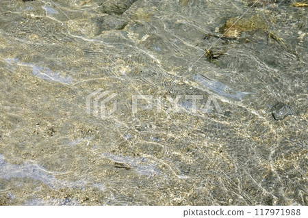 The ripples of the transparent river surface The ripples of the transparent river surface 117971988