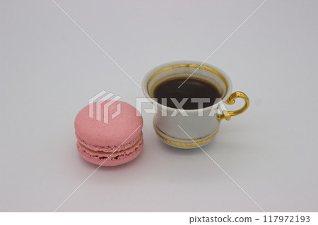 Elegant Pink Macaron Paired with a Delicate Cup of Coffee Elegant Pink Macaron Paired with a Delicate Cup of Coffee 117972193