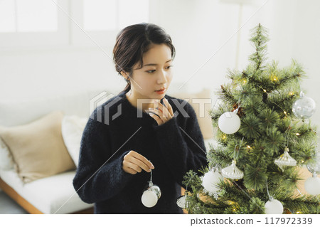 Christmas wreath and women Christmas wreath and women 117972339