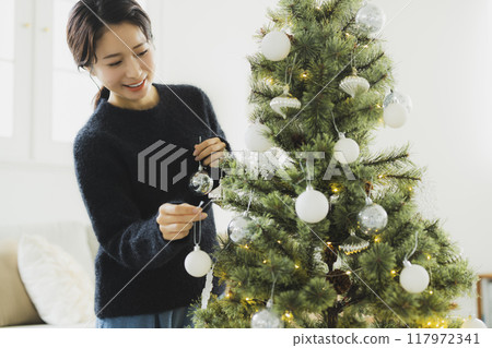 Christmas wreath and women Christmas wreath and women 117972341