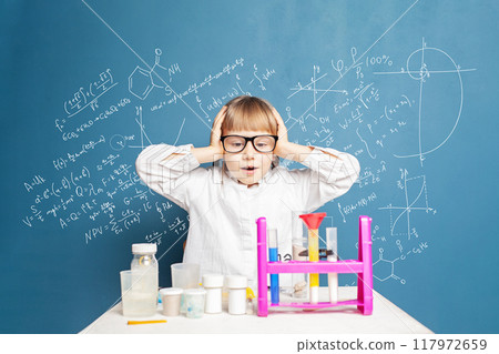 Surprised young school student girl learning science. Research and education concept Surprised young school student girl learning science. Research and education concept 117972659