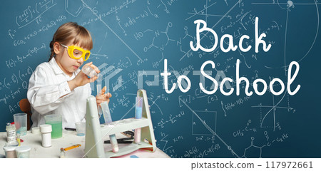 Clever school kid on blue color background. Education and Back to school concept Clever school kid on blue color background. Education and Back to school concept 117972661