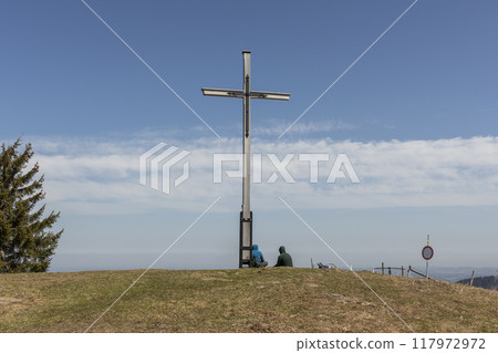 Summit cross of Rechelberg mountain in springtime, Bavaria, Germany 117972972