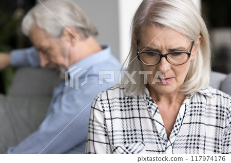 Sad wife thinks about relationship problems after fight with husband Sad wife thinks about relationship problems after fight with husband 117974176