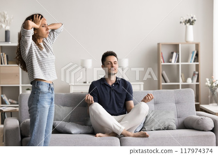 Husband meditate while his wife throws a tantrum 117974374