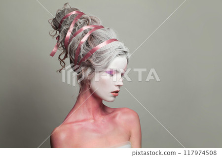 Female head and profile with makeup and creative hairstyle, beautiful face close-up Female head and profile with makeup and creative hairstyle, beautiful face close-up 117974508
