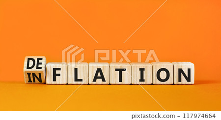 Deflation or inflation symbol. Concept word Deflation Inflation on beautiful wooden cubes. Beautiful orange table orange background. Business deflation inflation concept. Copy space Deflation or inflation symbol. Concept word Deflation Inflation on beautiful wooden cubes. Beautiful orange table orange background. Business deflation inflation concept. Copy space 117974664