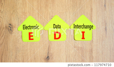 EDI electronic data interchange symbol. Concept words EDI electronic data interchange on yellow paper on a beautiful wooden background. Business and EDI electronic data interchange concept. Copy space 117974710