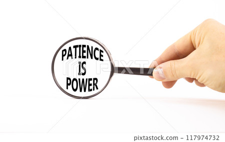 Patience is power symbol. Concept words Patience is power in beautiful magnifying glass. Beautiful white table white background. Businessman hand. Business and patience is power concept. Copy space. 117974732