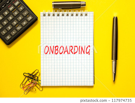 Onboarding success symbol. Concept word Onboarding on beautiful white note. Beautiful yellow paper background. Black calculator. Black pen. Business onboarding success concept. Copy space. 117974735