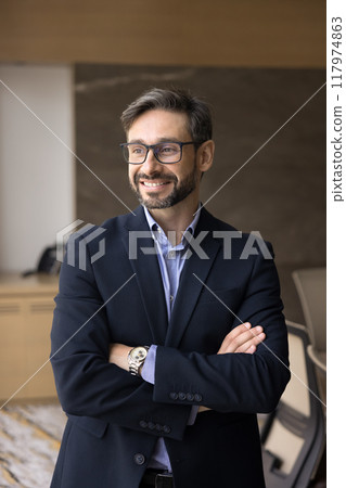 Happy middle aged Latin company CEO man posing in office Happy middle aged Latin company CEO man posing in office 117974863