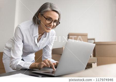 Woman check marketplace platform sales stats feels happy 117974946