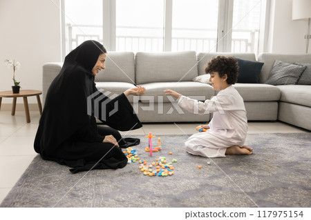 Happy Arabic mom enjoying leisure with adorable little son kid Happy Arabic mom enjoying leisure with adorable little son kid 117975154