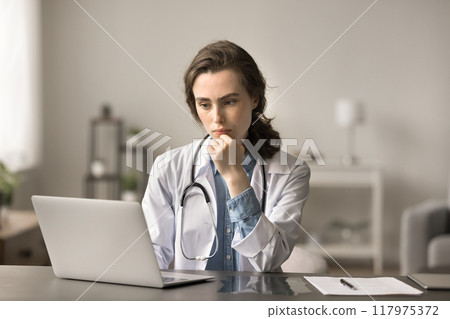 Doctor using laptop analyzing data, review diagnosis and treatment plan Doctor using laptop analyzing data, review diagnosis and treatment plan 117975372