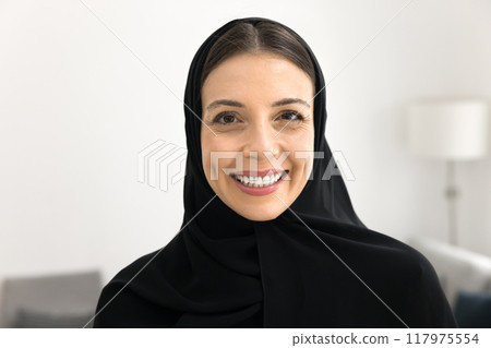 Cheerful beautiful young Arabic woman looking at camera 117975554