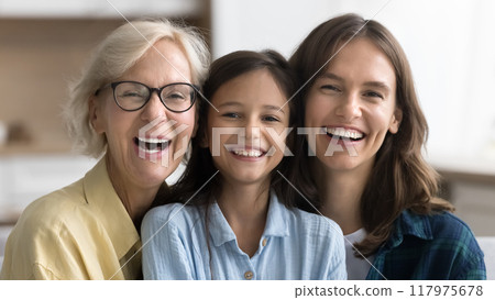 Happy cute child girl, mom and granny looking at camera 117975678