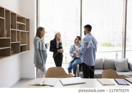 Happy diverse business colleagues meeting in office workspace 117975874