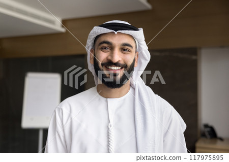 Cheerful successful Arab business leader man looking at camera Cheerful successful Arab business leader man looking at camera 117975895