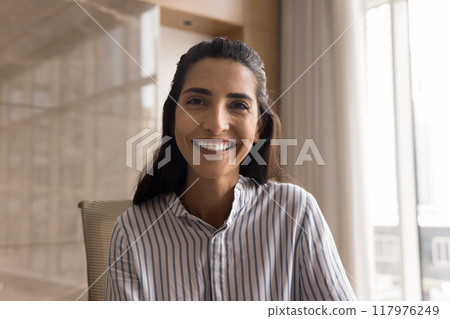Happy attractive Latin manager woman looking at camera 117976249