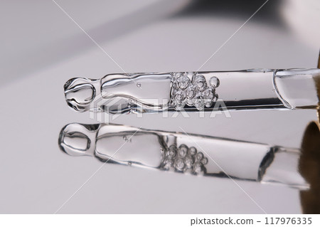Pipette with cosmetic gel or serum close-up. Pipette with cosmetic gel or serum close-up. 117976335