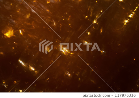 Festive dark gold abstract background with sparkles. Festive dark gold abstract background with sparkles. 117976336