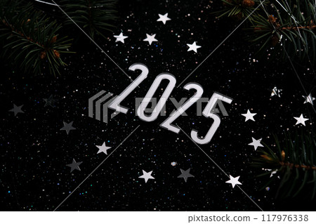 New Year 2025 dark background. Number of the coming year in Christmas decoration. 117976338