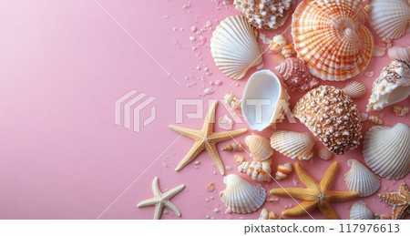 A collection of seashells and starfish arranged on a soft pink background for a coastal decor theme 117976613