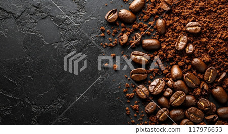 Freshly ground coffee beans on a dark surface ready for brewing morning coffee 117976653
