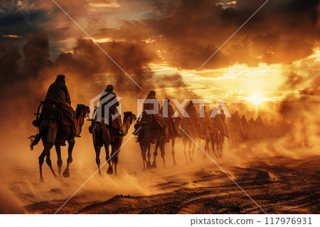 A caravan of camels with riders crosses the sultry desert, transporting goods on camels along a sand dune, nomadic life 117976931