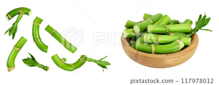 Green bamboo with leaves in wooden bowl isolated on white background . Top view with copy space for your text.. Flat lay 117978012